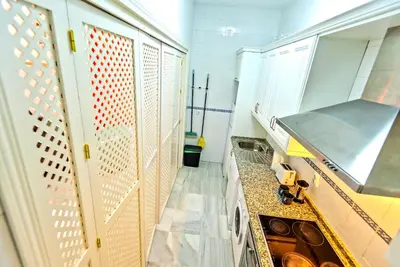 a kitchen with a sink and a stove at Central & Style - Bars and Restaurants all around Apartment in El Puerto de Santa María
