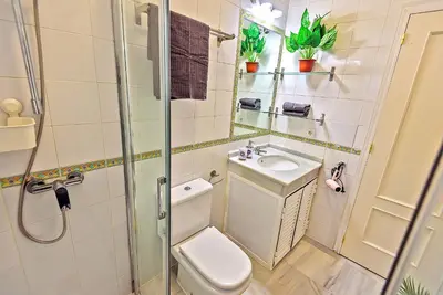 a bathroom with a toilet and a sink at Central & Style - Bars and Restaurants all around Apartment in El Puerto de Santa María