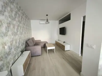 a living room with a couch and a tv at Happiness in San Fernando