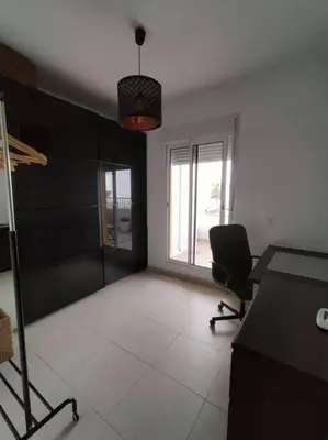 a room with a desk and a chair and a window at Dunas de Punta Candor in Rota