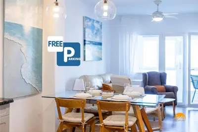 a dining room with a table and chairs at Balcón de Santa María Free Parking by Cádiz Time in Cádiz