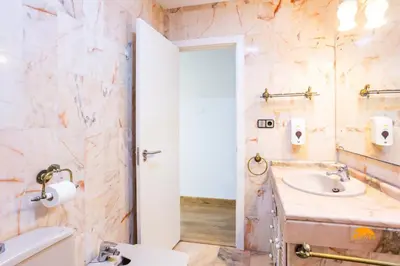 a bathroom with a sink and a mirror at Balcón de Santa María Free Parking by Cádiz Time in Cádiz