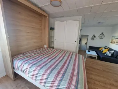 a bedroom with a large bed and a couch at Casa Consuelo in Jerez de la Frontera