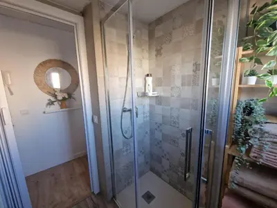 a shower with a glass door in a bathroom at Casa Consuelo in Jerez de la Frontera