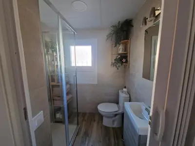 a bathroom with a shower and a toilet and a sink at Casa Consuelo in Jerez de la Frontera