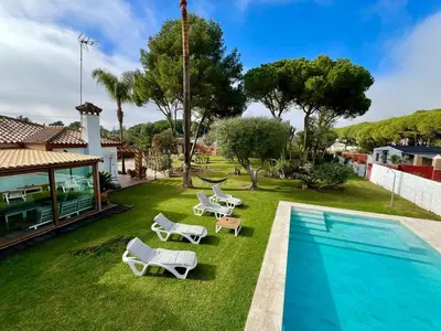 an image of a yard with a swimming pool at Los Porches in Chiclana de la Frontera