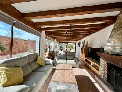 a living room with a couch and a fireplace at Los Porches in Chiclana de la Frontera