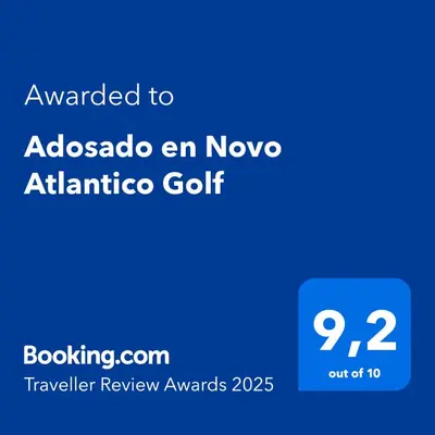a blue screen with the text awarded to abacus en novo atatalico at Adosado en Novo Atlantico Golf in Novo Sancti Petri