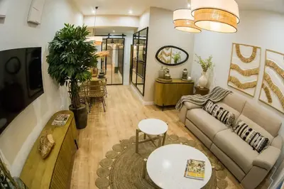 a living room with a couch and a table at Apartamento premium Prioral in El Puerto de Santa María