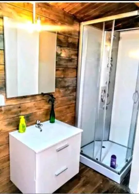 a bathroom with a shower and a sink and a sink at Centro ecuestre Girasol in Chiclana de la Frontera