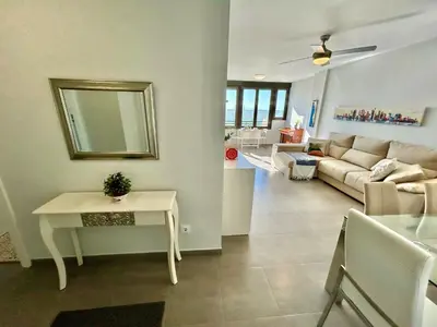a living room with a couch and a table at GATU Arena 