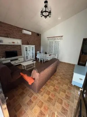 a living room with a couch and a table at Lurasejo in Cádiz
