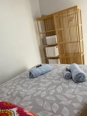 a bedroom with a bed with two pillows on it at SOTAVENTO La Solera in Sanlúcar de Barrameda