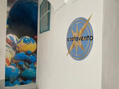 a scientology sign on a wall next to balls at SOTAVENTO La Solera in Sanlúcar de Barrameda