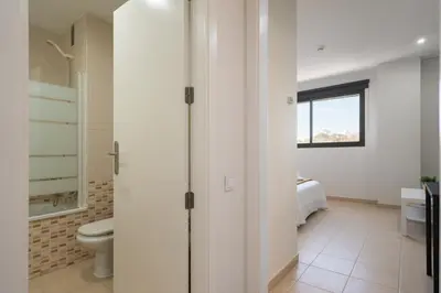 a bathroom with a toilet and a sink at Apartoyou - Estudio del Sol in El Puerto de Santa María