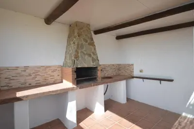 a kitchen with a stone stove in a room at Casas Buenavista in Conil de la Frontera