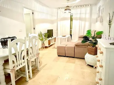 a living room with a couch and a table at Bonito y ubicación inmejorable in Sanlúcar de Barrameda