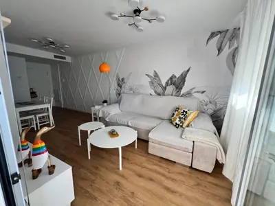 a living room with a couch and a table at Jardines del Porvenir 2 in Puerto Real