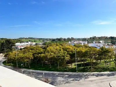 a view of a park with trees and houses at Jardines del Porvenir 2 in Puerto Real
