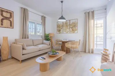 a living room with a couch and a table at Terrace Home by LiveWork in Cádiz