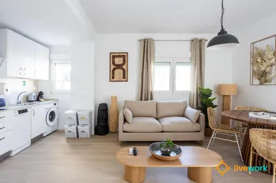 a living room with a couch and a table at Terrace Home by LiveWork in Cádiz