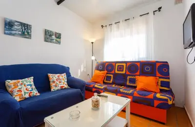 a living room with a couch and a table at Apartamento Casa Postas II in Conil de la Frontera