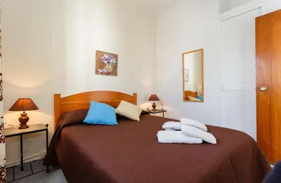 a bedroom with a bed with towels on it at Apartamento Casa Postas III in Conil de la Frontera