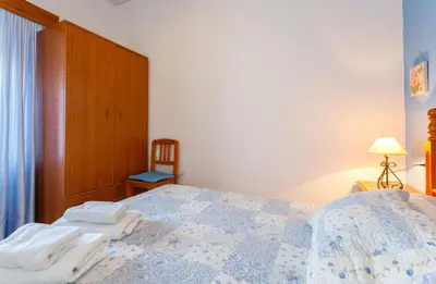 a bedroom with a bed with two towels on it at Apartamento Casa Postas I in Conil de la Frontera