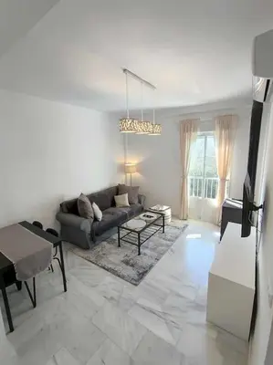 a living room with a couch and a table at Casa Mirador del Puente in Arcos de la Frontera