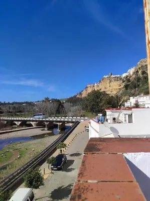 a view of a bridge over a river with a mountain at Casa Mirador del Puente in Arcos de la Frontera