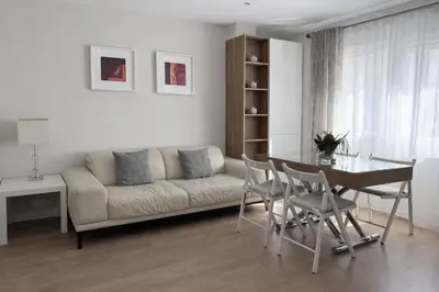 a living room with a couch and a table at Apartamento Amaro Cádiz - Playa Victoria in Cádiz