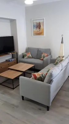 a living room with a couch and a table at Sanlucar-Centro in Sanlúcar de Barrameda