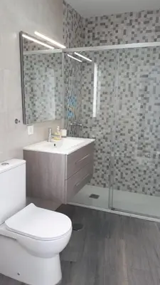 a bathroom with a toilet and a sink and a shower at Sanlucar-Centro in Sanlúcar de Barrameda