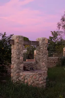 a stone fireplace in the middle of a field at El Fogón del Duende in Arcos de la Frontera
