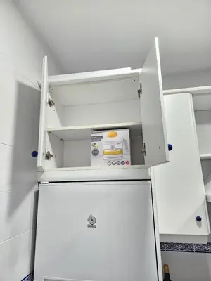 a white refrigerator with its door open in a kitchen at Apartamento Centro Cabildo in Sanlúcar de Barrameda