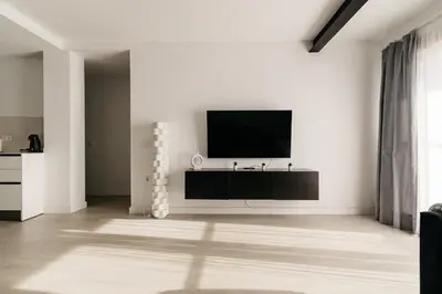 a living room with a flat screen tv on a wall at Bahía Encanto in El Puerto de Santa María