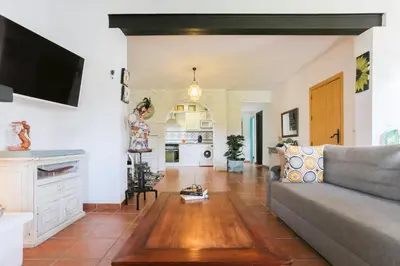 a living room with a couch and a tv at Let´s go to Valhalla in Chiclana de la Frontera