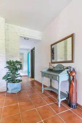 a room with a table and a mirror at Let´s go to Valhalla in Chiclana de la Frontera