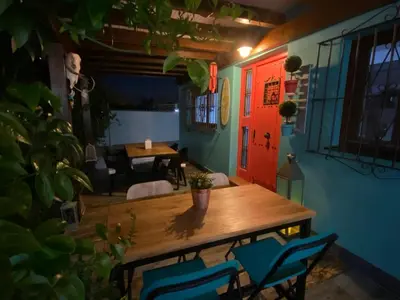 a dining room with a wooden table and chairs at Let´s go to Valhalla in Chiclana de la Frontera