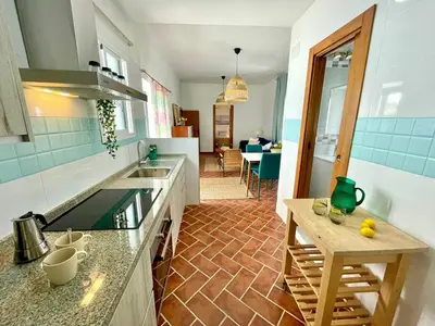 a kitchen with a sink and a counter at GINVA - Casa palacio La Templanza in El Puerto de Santa María