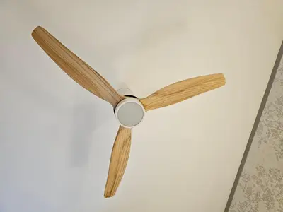 a ceiling fan hanging on a white wall at El Anfitrión - Palacio Argüeso in Sanlúcar de Barrameda