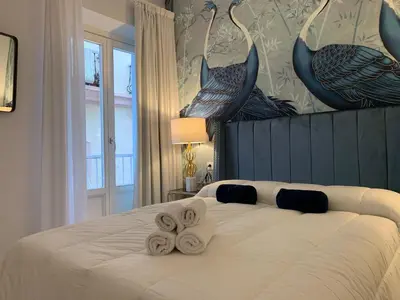 a bedroom with a bed with towels on it at San Francisco Centro in Cádiz