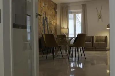 a kitchen with white cabinets and a washing machine at San Francisco Centro in Cádiz