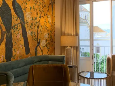 a large white bed with two pillows on it at San Francisco Centro in Cádiz