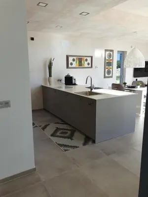 a kitchen with a sink and a counter at Villa La Vida in Chiclana de la Frontera