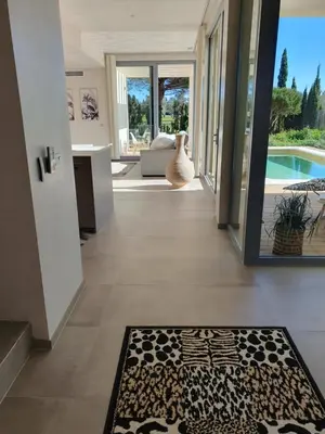 a hallway of a house with a rug on the floor at Villa La Vida in Chiclana de la Frontera