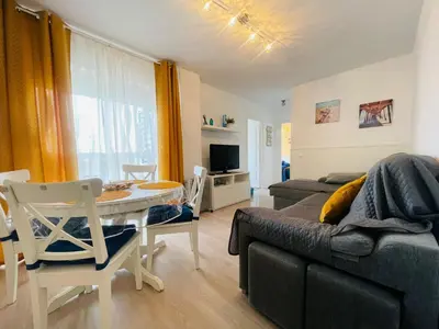 a living room with a couch and a table at Apartamento Las Olas de Valdelagrana in El Puerto de Santa María