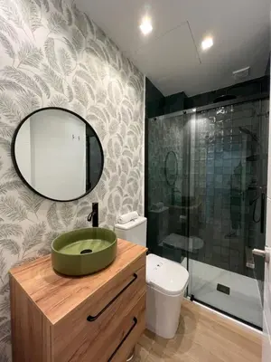 a bathroom with a green sink and a mirror at Hidden Gem. Capuchinos Boutique Homes in Cádiz