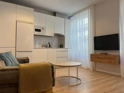 a living room with a couch and a table at Hidden Gem. Capuchinos Boutique Homes in Cádiz