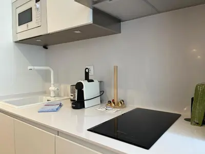 a kitchen with a sink and a coffee maker on a counter at Hidden Gem. Capuchinos Boutique Homes in Cádiz